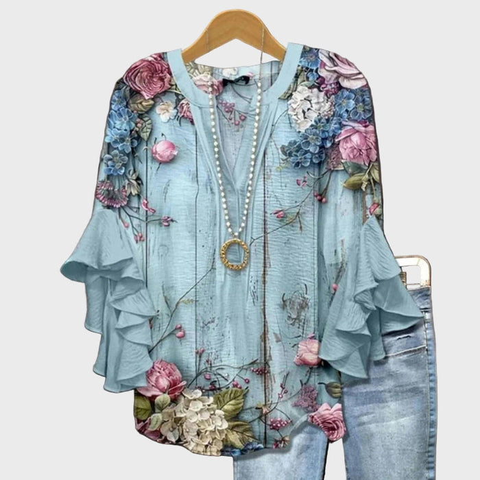 Elegant bluse med blomsterprint og flæseærmer