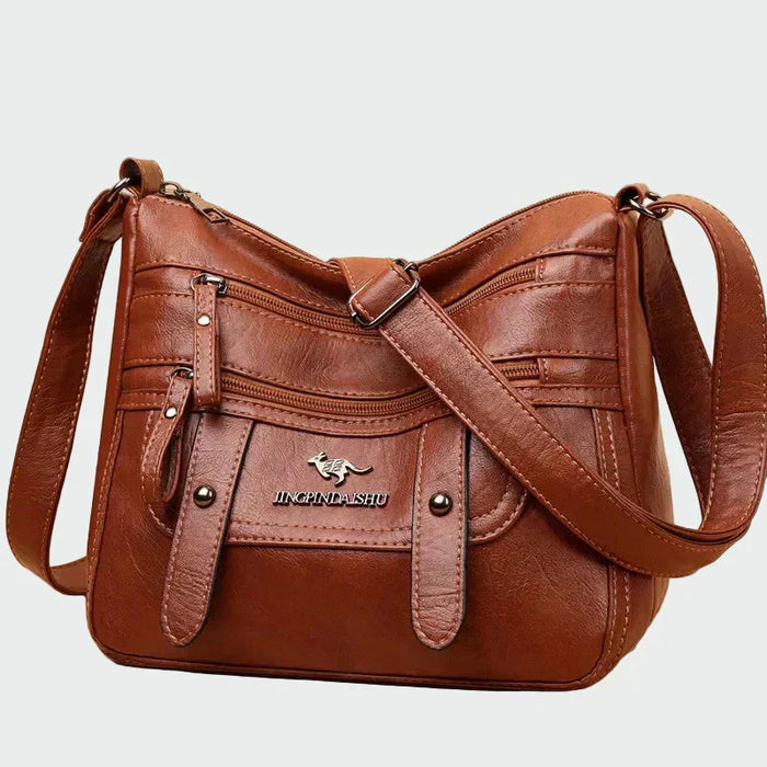 Brun crossbody-taske med mange lommer