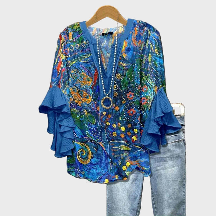 Blå bluse med abstrakt kunstprint